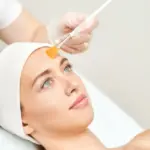 Woman receiving a professional chemical peel treatment in New York, NY.